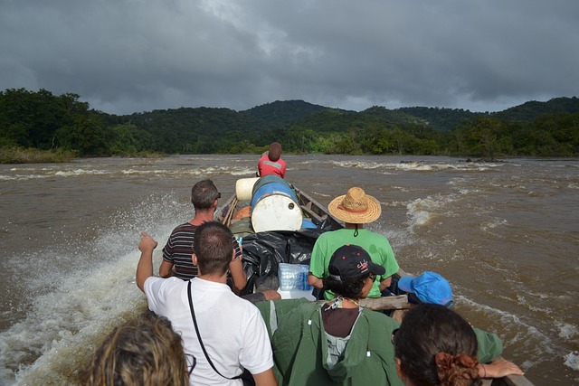 people in a boat on the river