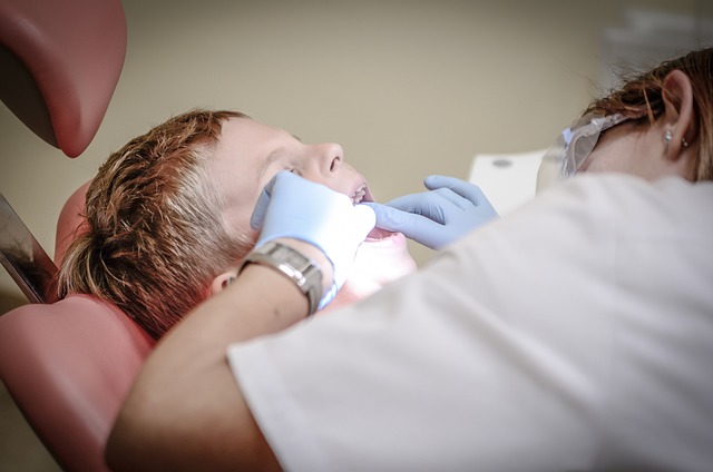 Hygienist cleaning a patient's teeth