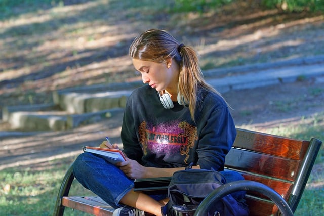 Young girl sitting on a bench