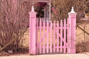 Pink fence representing prevention as a part of our health and wellness strategy.