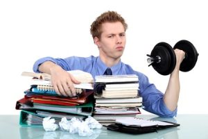 young man with documents and dumbbell