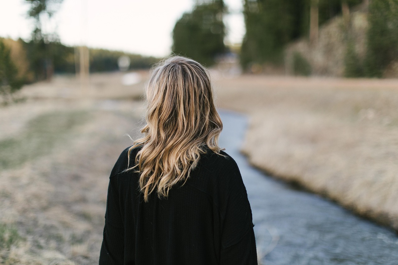 woman looking at trail